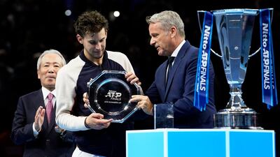 Dominic Thiem receives his trophy. EPA
