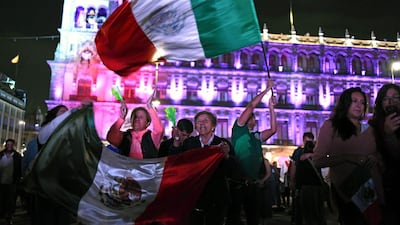 Supporters of the presidential candidate for the "Juntos haremos historia" coalition, Andres Manuel Lopez Obrador, celebrate at the Zocalo square in Mexico City, after getting the preliminary results of the general elections on July 1, 2018. Anti-establishment leftist Andres Manuel Lopez Obrador won Mexico's presidential election Sunday by a large margin, according to exit polls, in a landmark break with the parties that have governed for nearly a century. Johan Ordonez / AFP