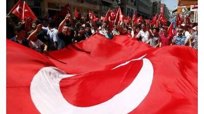 Demonstrators shout slogans against the outlawed Kurdistan Workers Party (PKK) during a demonstration in Istanbul on Sunday after Kurdish fighters killed 13 Turkish soldiers in the worst clash since the PKK ended a ceasefire in February.