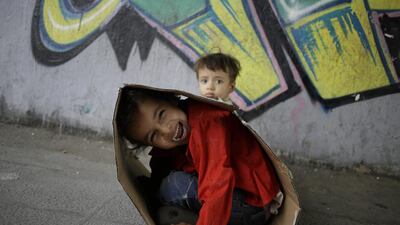 Children play under a bridge in Cairo, Egypt. Hassan Ammar / AP Photo