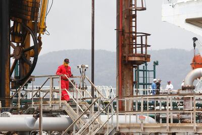 A Venezuelan oil worker walks in El Palito refinery during the arrival of Iranian oil tanker Fortune near Puerto Cabello, Venezuela, on May 25. Ernesto Vargas / AP