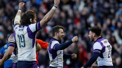 Greig Laidlaw, centre, celebrates with his Scotland teammates after they beat France in the Six Nations. Lee Smith / Action Images via Reuters