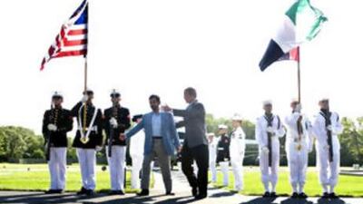 Sheikh Mohammed bin Rashid, the Vice President and Ruler of Dubai, walks with George W Bush, the US president, at Camp David, Maryland.