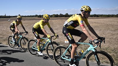 Team Jumbo's Primoz Roglic, centre, wearing the overall leader's yellow jersey. AFP