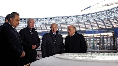 From left, Russian sport minister Vitaly Mutko, Moscow mayor Sergey Sobyanin, Russian president Vladimir Putin and Fifa president Sepp Blatter look at a scale-model of Luzhniki stadium during Blatter's visit to Moscow on October 28, 2014. Mikhail Klimentyev / AFP