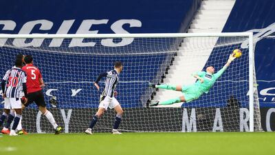 Baggies goalkeeper Sam Johnstone tips a late Harry Maguire chance onto the woodwork. Reuters