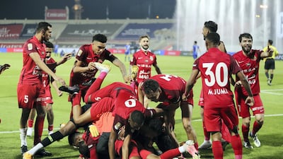 Shabab Al Ahli celebrate winning the match on penalties. Chris Whiteoak / The National