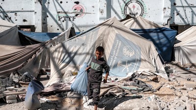 Tents sheltering displaced Palestinians at a school in Nuseirat refugee camp, which was hit by Israeli bombardment in central Gaza on Thursday. AFP