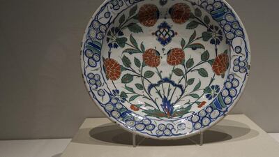 'Iznik Dish with Floral Desgins', stonepaste, underglaze painted in white ground, about 1570 - 1580 CE, Iznik, Ottoman Turkey. Mona Al-Marzooqi / The National