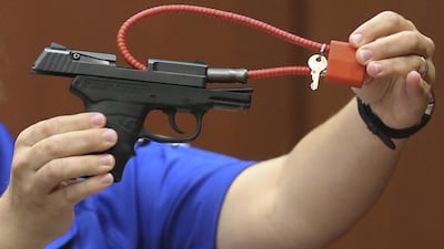 George Zimmerman's gun, shown to the jury during his trial in 2013. Gary W Green / EPA
