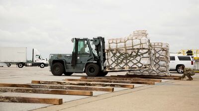 Pallets of baby and infant formula are unloaded from a US military aircraft at Indianapolis International Airport. Bloomberg