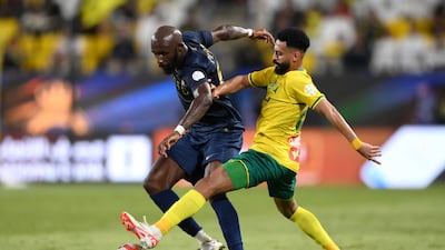 Seko Fofana of Al Nassr is tackled by Mansour Hamzi of Al Khaleej during the Saudi Pro League match. Getty Images