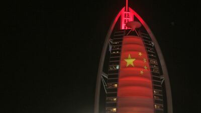 The Chinese flag is projected onto the Burj Al Arab in Dubai. AP Photo