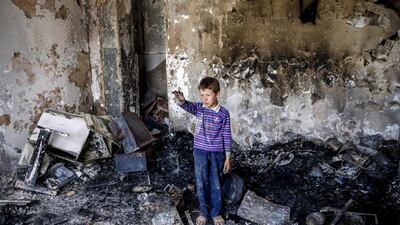 An Afghan child stands in his damaged room a day after a suicide attack followed by a gunfight against the office of Afghan former chief of intelligence and current candidate for first vice president of Ashraf Ghani, in Kabul, Afghanistan. According to reports, at least 20 people were killed and 50 others wounded in the incident which targeted the office of Amrullah Saleh. EPA