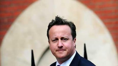 British Prime Minister David Cameron arrives to give evidence at the Leveson Inquiry into media ethics at the High Court in London.
