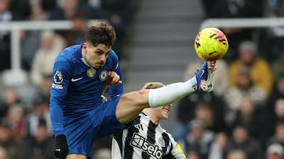 Chelsea's Pedro Neto in action with Newcastle United's Lewis Hall. Reuters