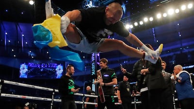 Oleksandr Usyk celebrates after beating Anthony Joshua in their heavyweight world title fight at the Tottenham Hotspur Stadium on Saturday, September 25. Reuters