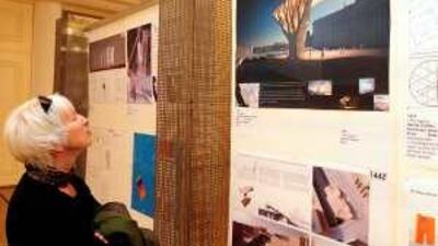 A woman looks at one of the 538 designs submitted in a public competition for Germany's planned national unity monument.