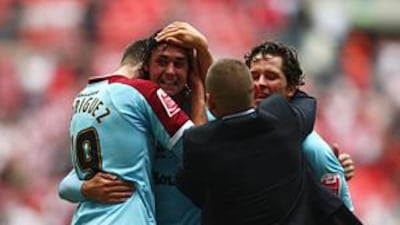 Burnley players celebrate after winning the Championship play-off final against Sheffield United at Wembley.