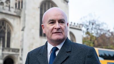 Mick Lynch, general secretary of the Rail, Maritime and Transport union, speaks to the media outside the Houses of Parliament in London. PA