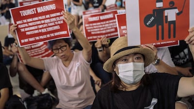 Protesters rally against the extradition bill in the arrivals hall. Getty Images