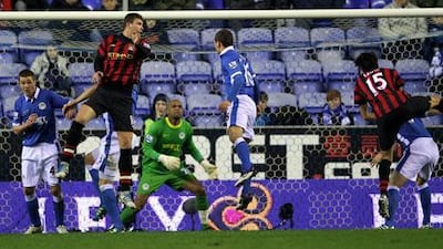 Edin Dzeko scores the opening goal with his header attempt.