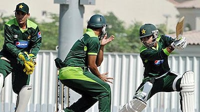 Umar Akmal, right, is more focused on batting while brother Adnan, left, is a specialist keeper.
