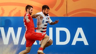 Lucas Roque, right, of the United States vies for the ball with Switzerland's Jan Ostgen. EPA