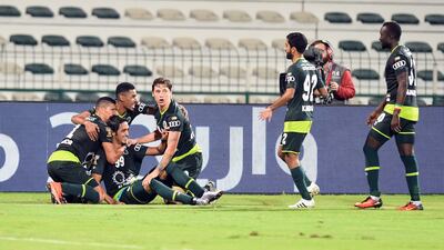 Al Shabab players celebrate with Mohammed Ibrahim after his opening goal against Al Wasl in the Arabian Gulf Cup semi-final on Monday night. Courtesy Arabian Gulf League