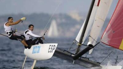 Fernando Echavarri and Anton Paz of Spain sailing in Tornado class approach the down wind mark in race one at the Beijing 2008 Olympic Games in Qingdao, Shandong province, August 15, 2008.