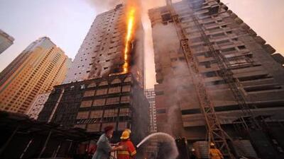 Preliminary investigations suggested a cigarette butt discarded near an electric circuit box in the Al Mansour building could have started the blaze.