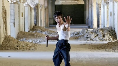 Abbas Alizada, who calls himself the Afghan Bruce Lee, poses in Kabul. Mohammad Ismail / Reuters