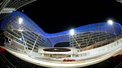 Giancarlo Fisichella, a Formula One driver for Ferrari, drives in front of the Yas Hotel last year.