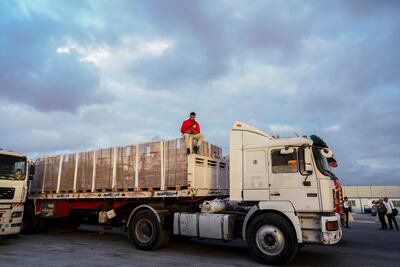 Aid trucks line up near the Rafah border crossing between Egypt and Gaza. EPA