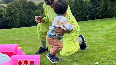 Sheikh Mohammed playing with his grandson Rashid.