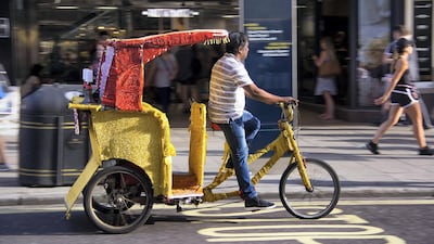 Bike taxi drivers come from across the world, including Turkey and south Asia. Shahzad Sheikh for The National