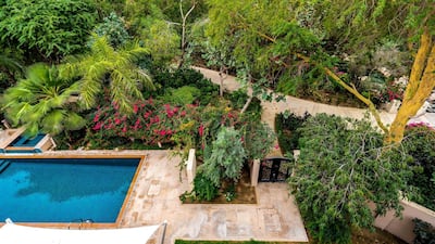 The back gate leads out into a communal garden. Courtesy LuxuryProperty.com
