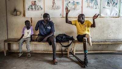 Patients who lost limbs in conflict wait to see doctors at a Red Cross-supported rehabilitation centre in South Sudan. AFP