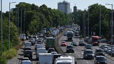 Cars queue in traffic in Hammersmith, west London, as commuters make their way to the city centre. AFP