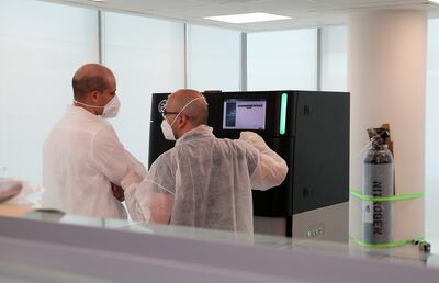 Lab technicians working in the Dante Labs at Silicon Oasis in Dubai. Pawan Singh / The National