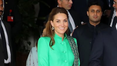 Catherine, Duchess of Cambridge, wears a green tunic coat by Catherine Walker and white trousers by Maheen Khan to meet Pakistan's Prime Minister Imran Khan at his official residence on Tuesday, October 15, 2019 in Islamabad, Pakistan. Getty Images