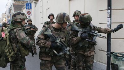 Police say two suspects in last week’s Paris attacks, a man and a woman, have been killed in a police operation north of Paris. Two police officers have been injured in the standoff. Police have said the operation is targeting the suspected mastermind of last week’s attacks, believed to be holed up in an apartment in Saint-Denis with several other heavily armed suspects. Francois Mori / AP