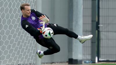 Germany goalkeeper Manuel Neuer makes a save in training. EPA