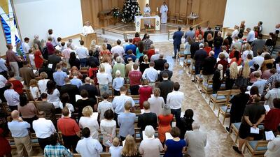 Thousands of people flocked to the church compound in Abu Dhabi on Friday for Christmas services, including this one at St Andrew's Church. Ravindranath K / The National