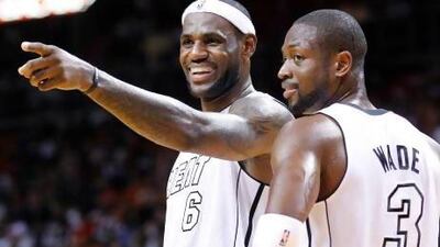 Forward LeBron James, left, and guard Dwyane Wade are bringing the heat for Miami.