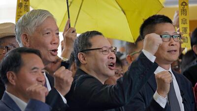 Occupy Central leaders shout slogans before their court hearing last month. Vincent Yu / AP