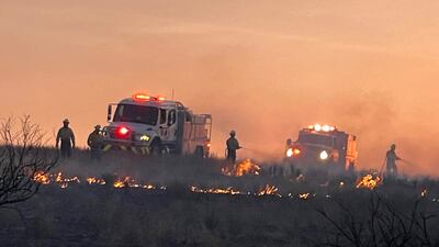 Amarillo firefighters during clean-up operations from the Windy Deuce fire, north of Amarillo. AFP
