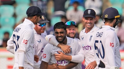 Rehan Ahmed is mobbed by his England teammate after dismissing India's Rajat Patidar. AP