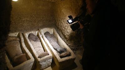 A videographer shoots mummies found at Tuna el-Gebel, Egypt. EPA