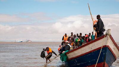 In this photo supplied by the Red Cross Red Crescent Climate Centre survivors of Cyclone Idai arrive by rescue boat in Beira, Mozambique, Thursday, March 21, 2019. The confirmed death toll in Mozambique, Zimbabwe and Malawi surpassed 500, with hundreds more feared dead in towns and villages that were completely submerged. (Photo -Denis Onyodi - Red Cross Red Crescent Climate Centre via AP)